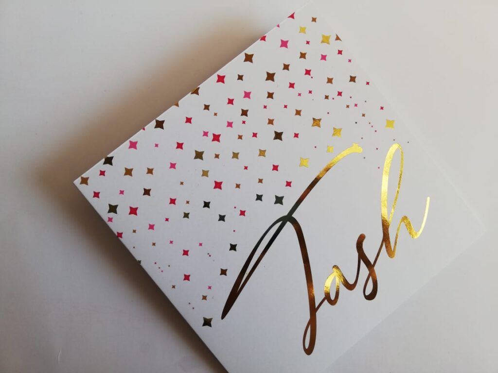 A personalised greeting card with the name Tash on it printed in gold foil.