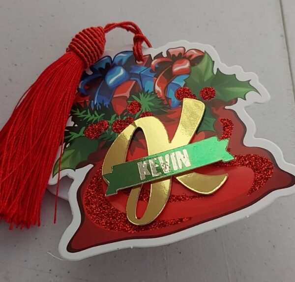 Handcrafted Christmas tag from Cardiology Cards featuring a festive design, vibrant red tassel, and personalized touch. Perfect for adding a unique and joyful flair to your holiday gifts. Sustainable and made with love for a memorable and eco-friendly celebration.