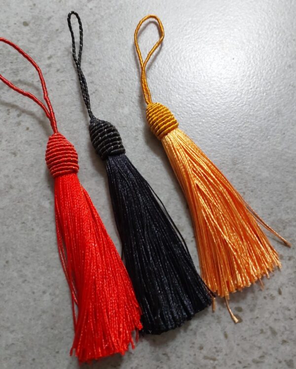 Christmas tassels in red, gold and black