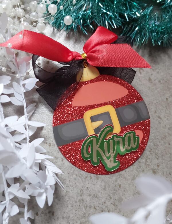 A christmas tag shaped like a Christmas bauble with the name Kyra on it