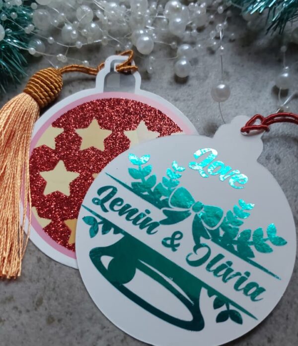 Handcrafted Christmas tag from Cardiology Cards featuring a festive design, vibrant red tassel, and personalized touch. Perfect for adding a unique and joyful flair to your holiday gifts. Sustainable and made with love for a memorable and eco-friendly celebration.